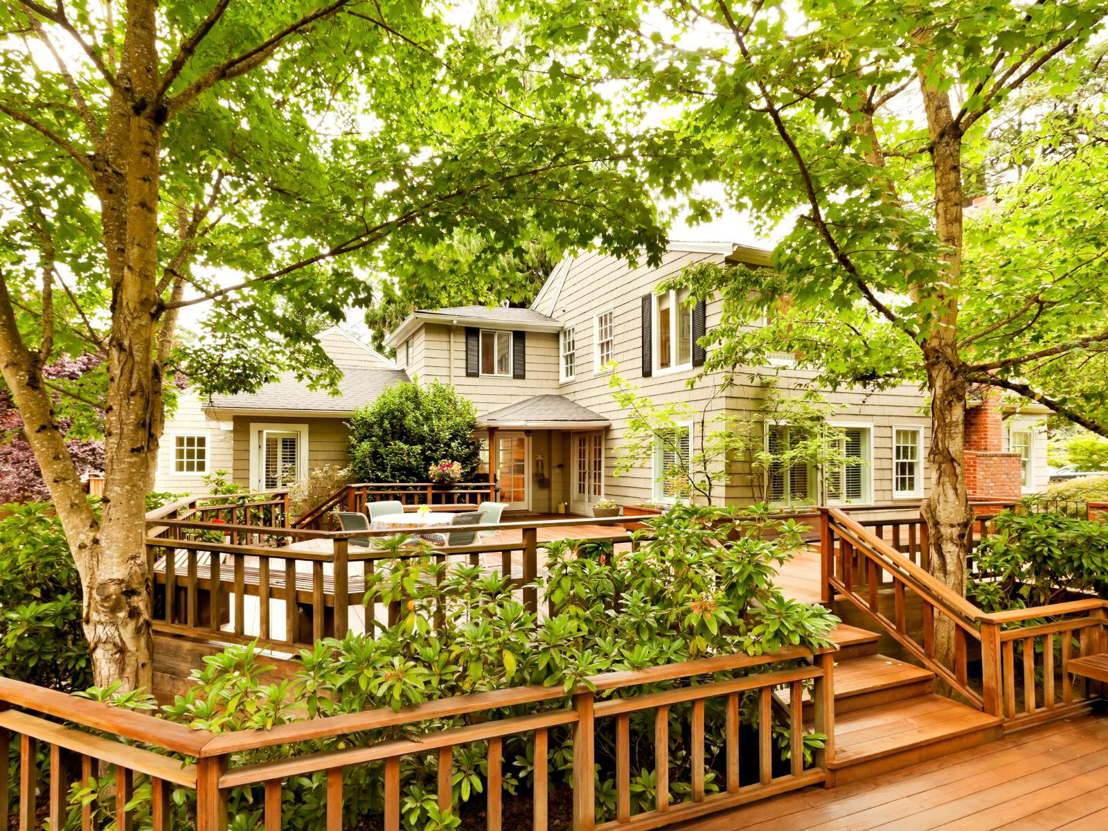 An image of a large custom built deck with premium trim and luxury finishing on the wood and railings.